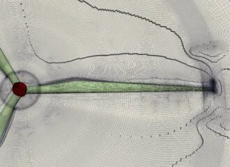 Structured multiblock hexahedral mesh around a wind turbine blade, showing refined grid distribution near the blade surface for accurate CFD simulation of aerodynamic performance and wake flow.